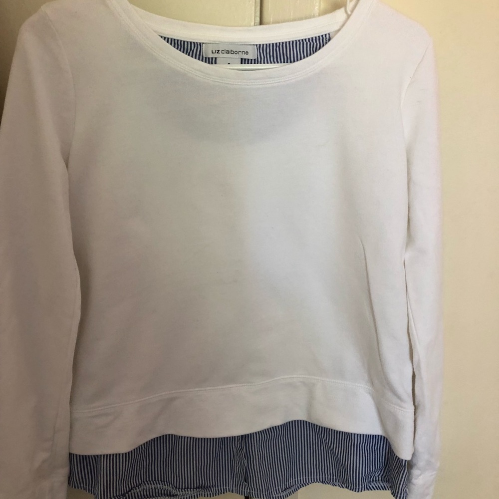 Liz Claiborne’s white sweater, blue stripe accent